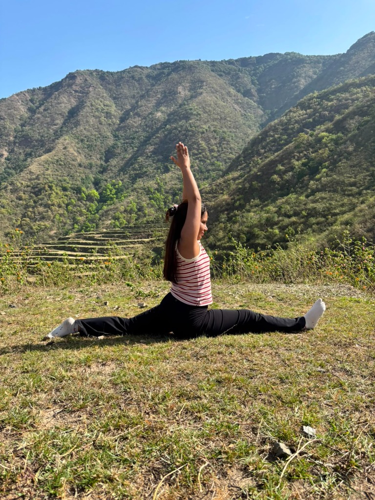 Hanumanasana splits pose with mountain backdrop